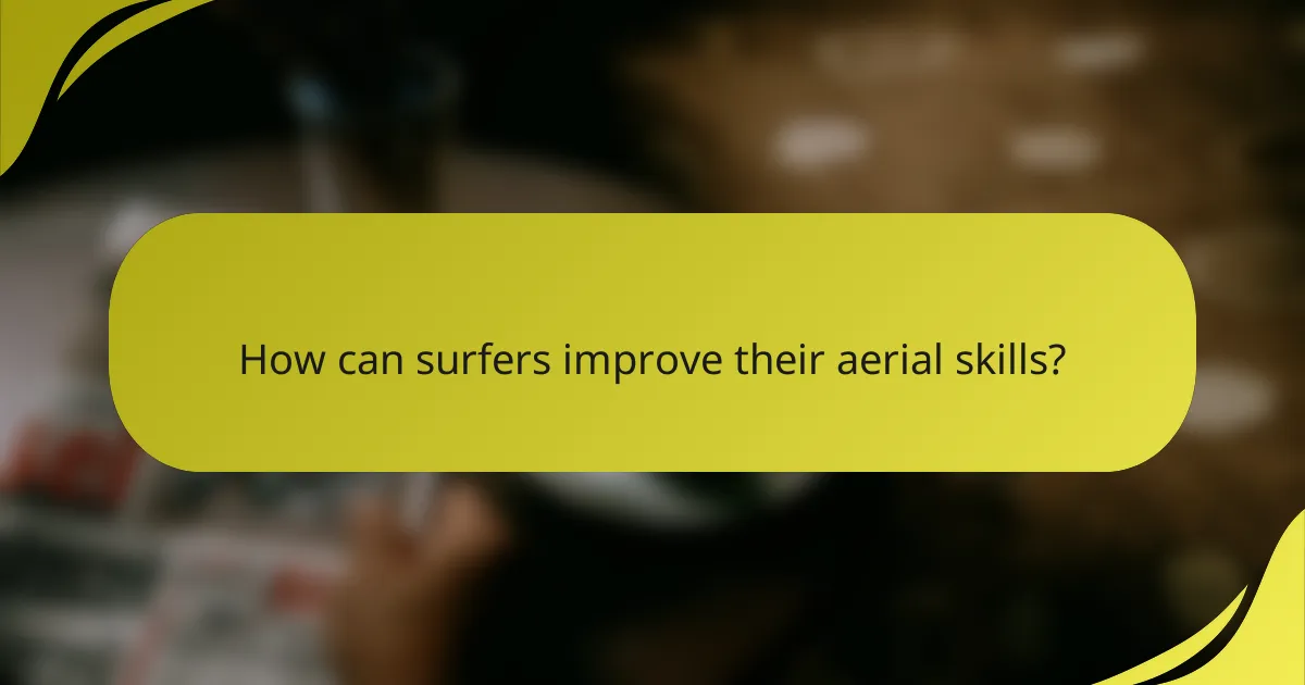 How can surfers improve their aerial skills?